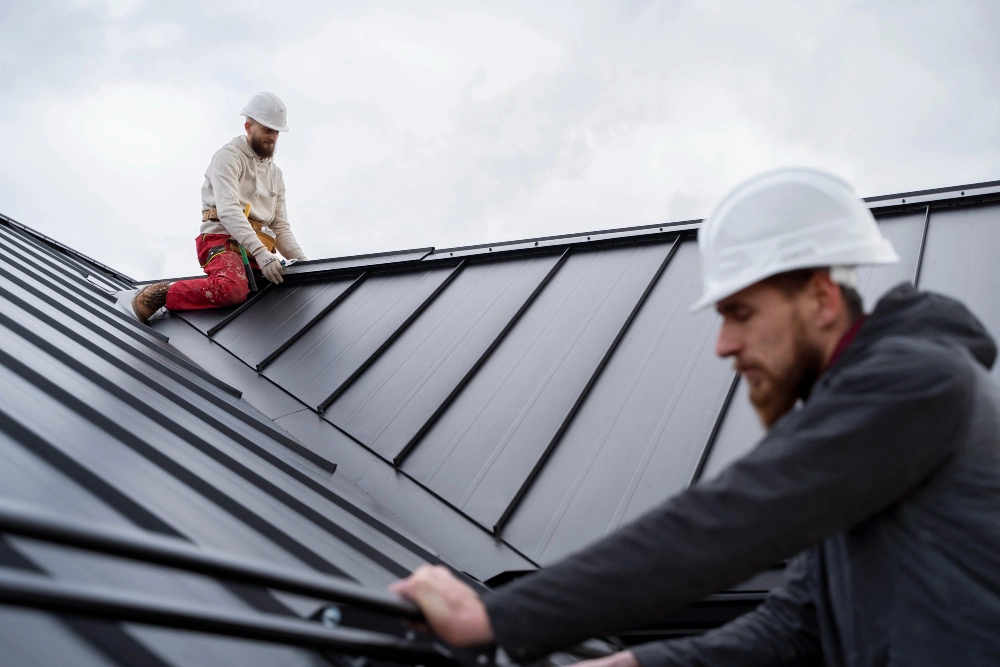 Medium shot men working on metal roof